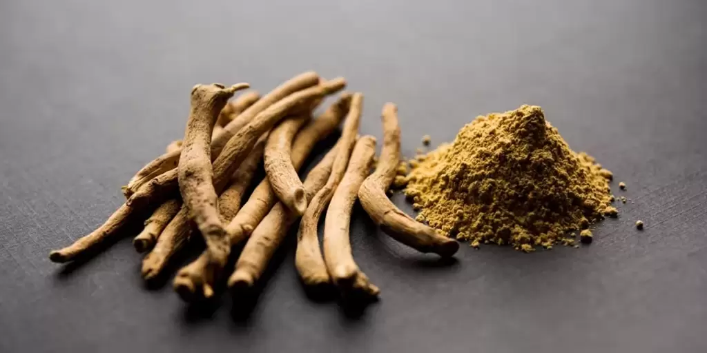 Ashwagandha Root And Powder On Grey Table jpg